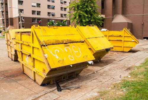 Front of business premises with commercial waste bins and collection crew arriving
